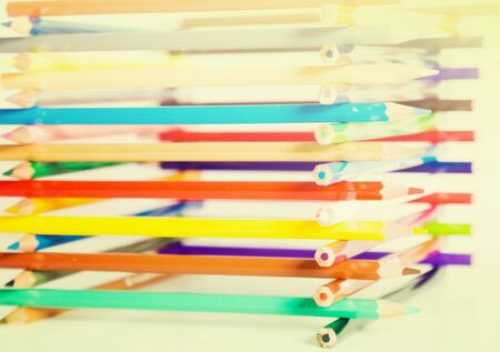 colored pencils stacked in log houseの写真素材
