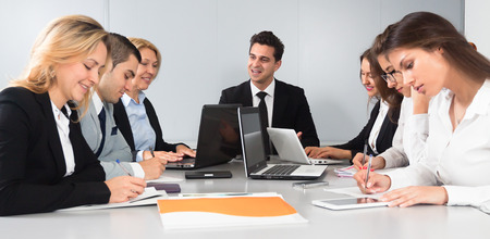 colleagues in negotiations in conference roomの写真素材