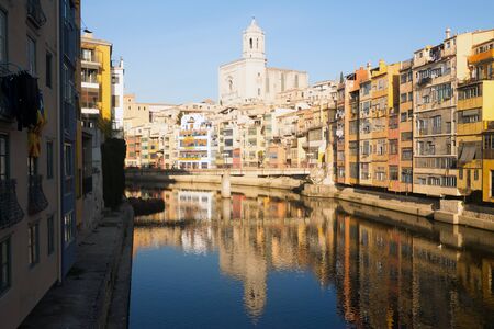 Day view of river and picturesque homes in Girona. Catalonia, Spainの写真素材
