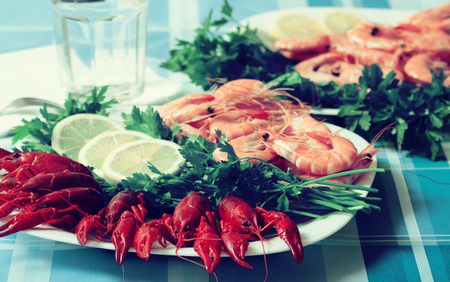 cooked prawns and crayfish served on plate close upの写真素材