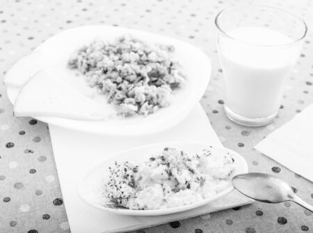 plate with curds covered with honey and chocolate. oatmeal, cheese and milkの写真素材