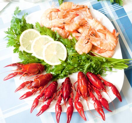 cooked shrimp and crayfish served on plate close upの写真素材