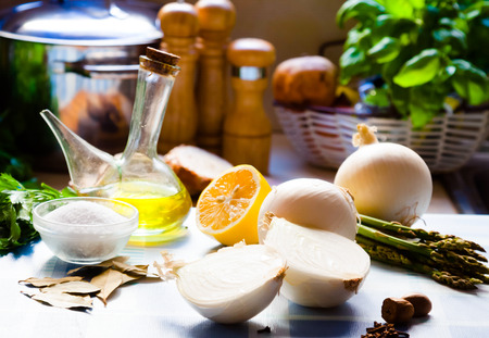Image Salt, olive oil, onion, asparagus on a tableの写真素材