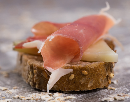 perfect sandwich made with rye bread cheese and Parma hamの写真素材