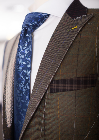 Elegant jacket with shirt and tie on mannequinの写真素材