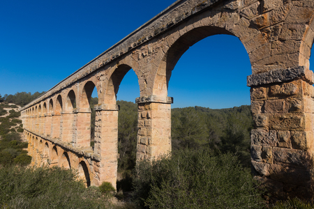 ancient Roman aqueduct in city of Taragona in summerの写真素材