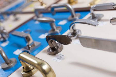 Stand with metal door handles in storeの写真素材