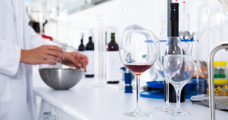 laboratory of winery. Checking the acidity of wine and organoleptic characteristicsの写真素材
