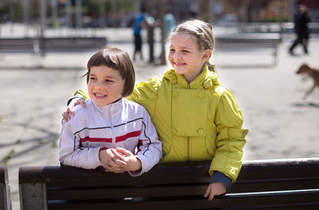 two children posing outdoors in the springの写真素材