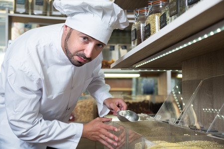 professional chef buys the best groceries in grocery storeの写真素材