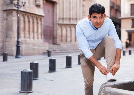 young man posing in gothic quarter of Barcelonaの写真素材