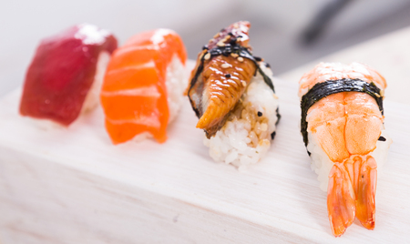 series of four kinds Nigirisushi. focus on ebiの写真素材