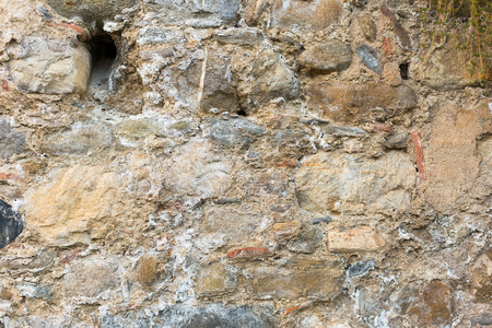 shabby surface of ancient wall of natural stoneの写真素材