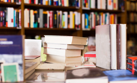 different art books lying on table in libraryの写真素材