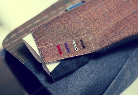 close up handmade buttonholes male jacketの写真素材