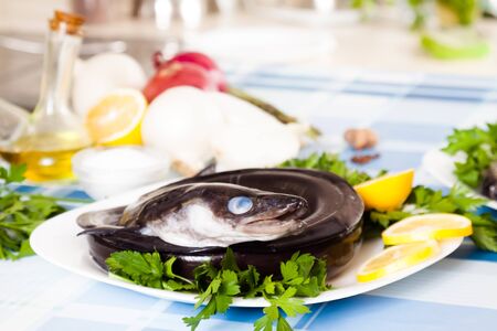 Image of freshness fish eel and vegetables on the plate at the table