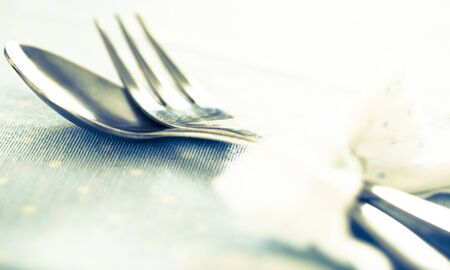 fork and spoon connected beautiful blue ribbonの写真素材