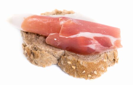 tasty sandwich made with rye bread and Parma ham on isolated backgroundの写真素材