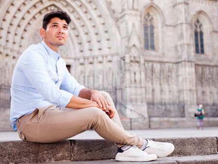 young man posing in gothic quarter of Barcelonaの写真素材