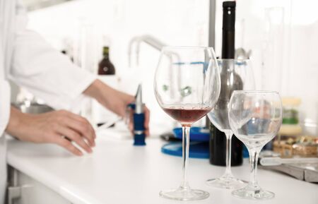 laboratory of winery. Checking the acidity of wine and organoleptic characteristicsの写真素材