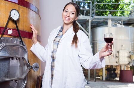 professional woman checks the wine at factory in Franceの写真素材