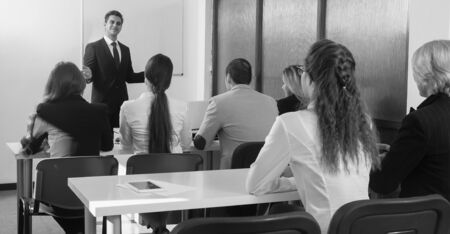Students listen to lecture in audienceの写真素材