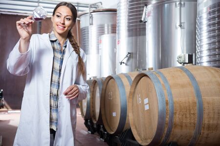 woman sommelier is tasting wine at Italian wine factoryの写真素材