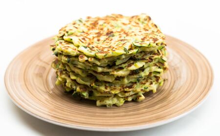 delicious fried zucchini pancakes with greek yogurtの写真素材