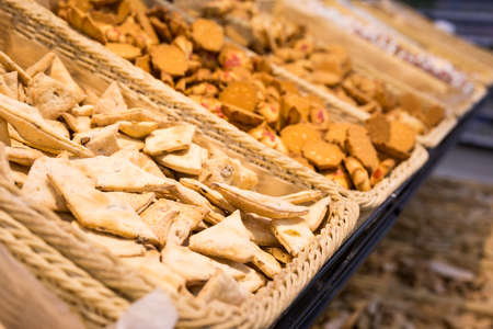 fresh crispy cookies in wicker baskets on the counter
