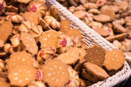fresh crispy cookies in wicker baskets on the counterの写真素材