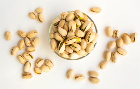 roasted salted pistachios on white backgroundの写真素材