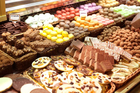 varieties of delicious chocolate sweets on counter