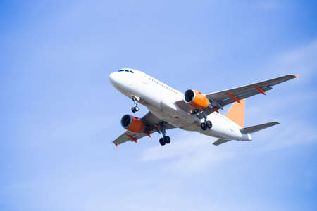 modern passenger plane lands at airportの写真素材