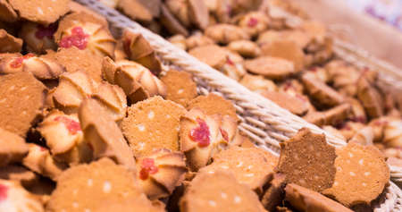 fresh crispy cookies in wicker baskets on the counter