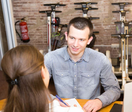 girl with guy hire board in rental salon