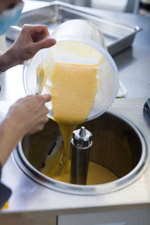 making ice cream from liquid mixtureの写真素材