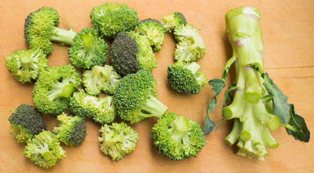 broccoli barrel without inflorescences on wooden boardの写真素材