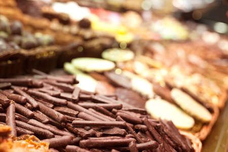 appetizing chocolate sticks on market counterの写真素材