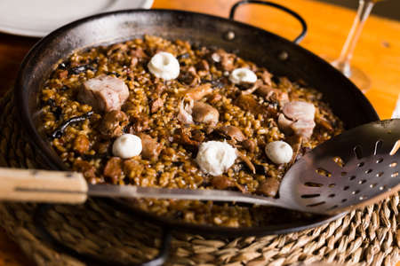 delicious Catalan mountain rice with mushrooms and pork feetの写真素材