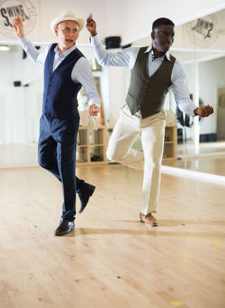 Two professional dancers practicing lindy hop in dance classの写真素材