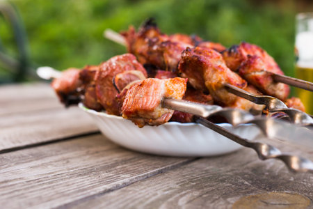 Top view of tasty shish kebab from pork on plateの写真素材