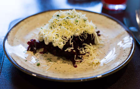 grated boiled beets with garlic, cheese and mayonnaiseの写真素材