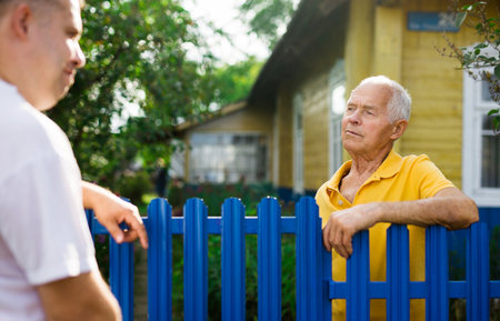 Old man talking with his neighbourの写真素材