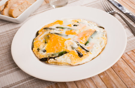 Scrambled eggs with asparagus for breakfastの写真素材