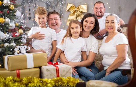 Family with children on sofa in christmas interiorの写真素材
