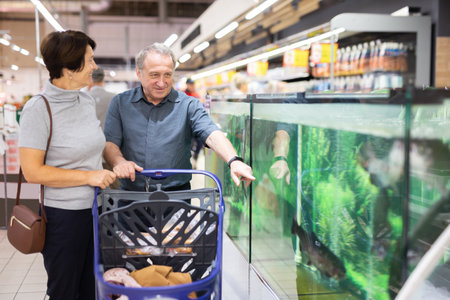Couple choose fish for festive dinnerの写真素材