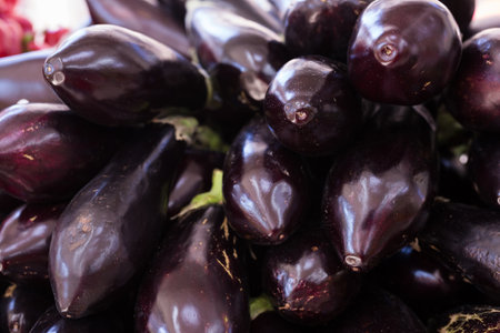 Fresh eggplant on market counterの写真素材
