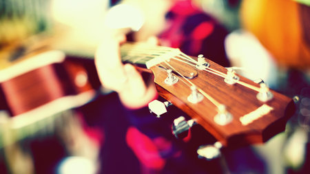 Close up of wooden head of guitar