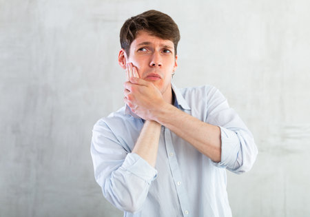 Unhappy man having a toothacheの写真素材