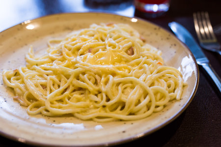 Traditional italian pasta carbonara on a plateの写真素材